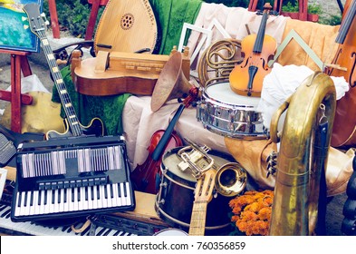 Pile Of Different Old Musical Instruments.