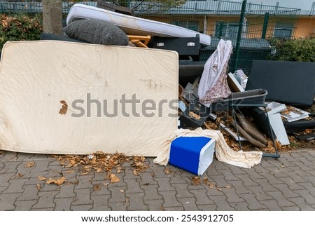 Similar – Image, Stock Photo Discarded mattress on the sidewalk in the light of a street lamp in front of an anonymous hotel façade