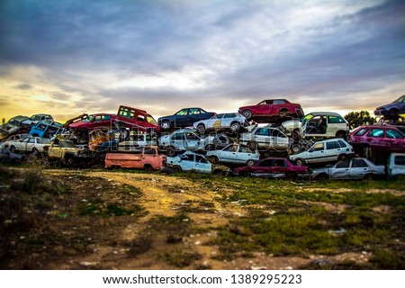 Pile of discarded old cars on junkyard