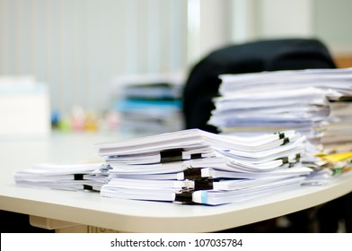 Pile Of Document On Desk