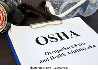 Pile Of Documents With Occupational Safety And Health Administration OSHA.