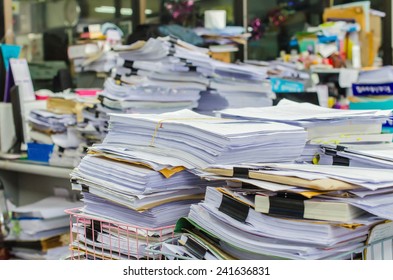 Pile Of Documents On Desk Stack Up High Waiting To Be Managed