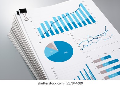 Pile Of Documents On Gray Reflection Background. Many Graphs And Charts. Concept Image Of Data Gathering.
