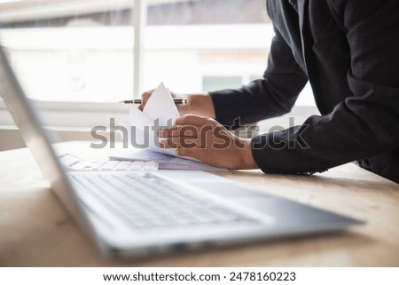 A pile of documents that the secretary has prepared for meetings of the company board of directors and investors. Many documents were arranged and prepared in piles on the desk in the secretary office