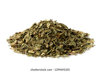 A Pile Of Dried Chopped Basil Isolated On White.