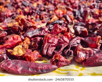 Pile of dried red chili Cayenne pepper. Red dry chili or chili Cayenne pepper, food concept background. Smoked dry red paprika spicy. Hot red chili pepper drying in the hot sun. Selective focus - Powered by Shutterstock