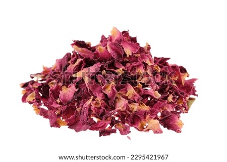 Pile of dried red rose petals (Rosa damascena), isolated on white background