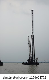Pile driven machine during piling activity for bridge project.