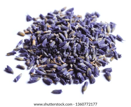 Pile of dry lavender flowers on a white background.