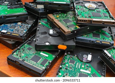 A Pile Of Dusty Broken And Obsolete Hard Drives For Disposal And Recycling. Electronic Data Warehouse