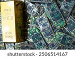 pile of electronic waste on factory floor is circuit board of mobile phone waiting to be processed extract gold to separate precious metal from electronic waste. extracting precious metal from e-waste