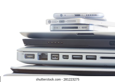 Pile Of Electronical Devices On White - Technology Concept