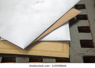 A Pile Of Enveloped Birthday Cards On A Garden Table