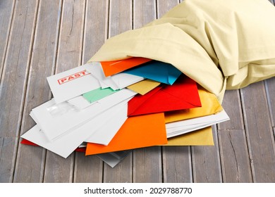 Pile Of Envelopes With Overdue Utility Bills On The Desk