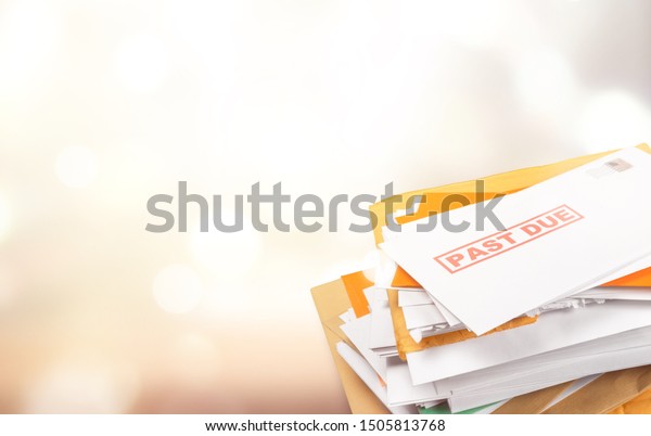Pile of envelopes with overdue utility bills\
isolated on white