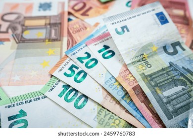 Pile of euro paper banknotes as finance background. Financial, saving or investment concept - Powered by Shutterstock