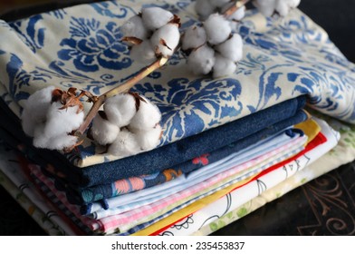 Pile Of Fabric And Cotton Plant Stock Photo