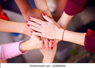 Pile Of Female Multiracial Hands In Union Sign