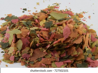 A Pile Of Fish Food Flakes For Tropical Fish