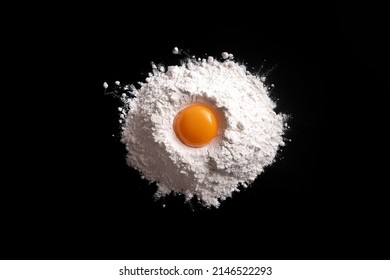 A Pile Of Flour And Broken Egg Cut Out. Top View.