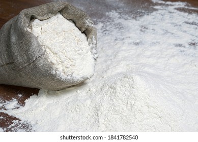 A Pile Of Flour On A Dark Table. Spilled Flour. Flour Texture