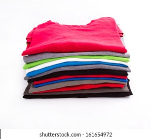 A Pile Of Folded T Shirts  