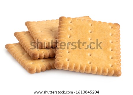 Pile of four rectangular butter biscuits isolated on white.