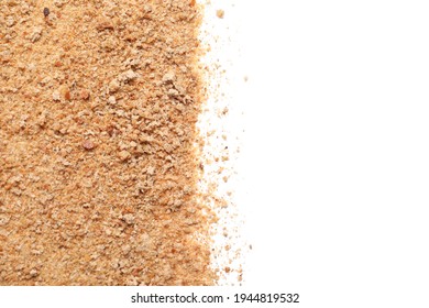 Pile of fresh bread crumbs on white background, top view