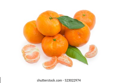 Pile Of A Fresh Mandarin Oranges With Leaf And Several Segment Of Peeled Mandarin On A Light Background
