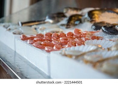 Pile of fresh red shrimps for sale on the seafood market, seafood on ice in Greece. - Powered by Shutterstock