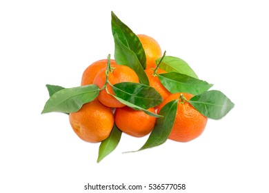 Pile Of Fresh Ripe Mandarin Oranges With Small Twigs And Leaves On A Light Background
