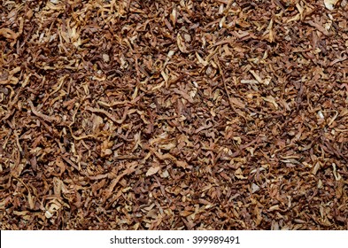 a pile of freshly cut tobacco texture in the background. closeup pattern
