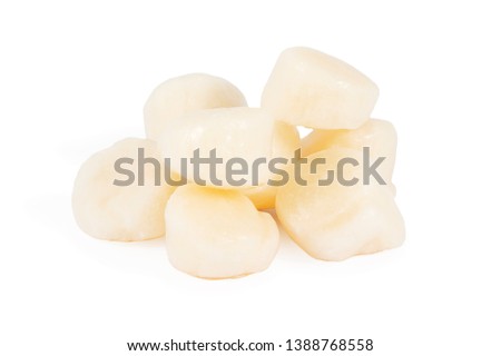 pile of frozen fillets of sea scallops, isolated on white background