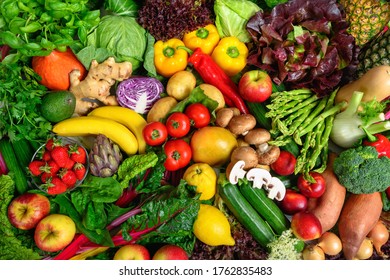 Pile of fruits and vegetables in many appetizing colors, shot from above, inviting to lead a healthy plant-based lifestyle and self-care