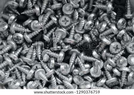 a pile of galvanized screws