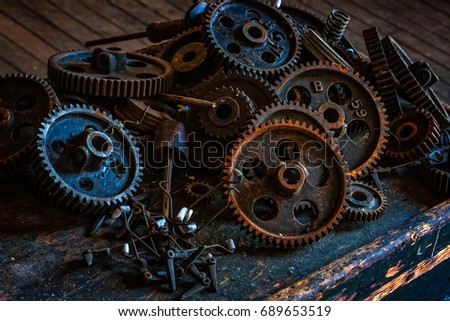 Pile of gears at an abandoned silk mill.