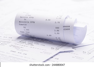 Pile Of Generic Rolled Up Receipt With Costs