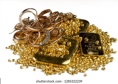 A Pile Of Gold Bars, Gold Jewelry And Gold Granules. Isolated On White Background. Selective Focus.