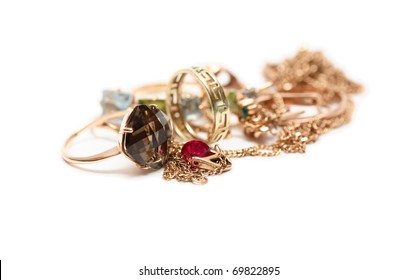 Pile Of Gold Jewelry Isolated On White Background