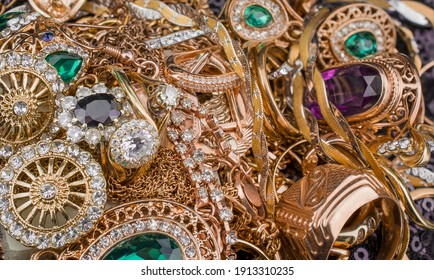 Pile Of Gold Jewelry On Black Background