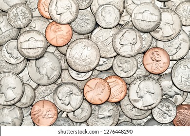 Pile of Golden coin, silver coin, copper coin, quarters, nickels, dimes, pennies, fifty cent piece and dollar coins. Various USA coins, American coins for business, money, financial coins and economy 