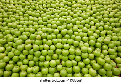 Pile Of Green Apples Forming A Background