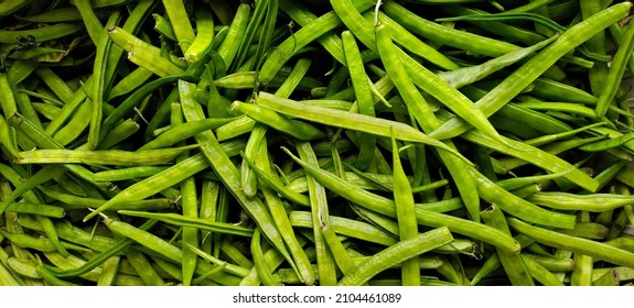 A pile of green Cluster beans - Shutterstock ID 2104461089