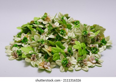 Pile Of Green Fake Flowers Isolated On White Background