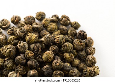 A Pile Of Green Jasmine Pearl Dried Tea On A White Background. Chinese Traditional Twisted Tea