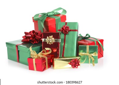 Pile Of Green, Red, And Gold Christmas Presents On White Background 