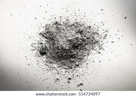 Pile of grey ash, dirt, sand, dust cloud, death remains background