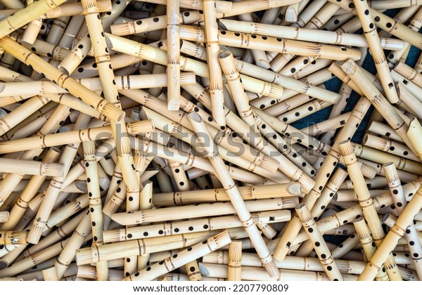 Pile of half-finished bamboo flutes,
handmade bamboo flute production process by craftsmen, bamboo
flutes being dried before finishing and
marketed