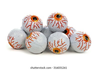 Pile Of Halloween Candy Eyeballs Over A White Background