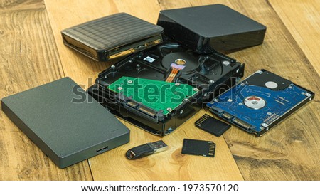 Pile of hdd memory storage devices over dark surface,tech components,usb,memory